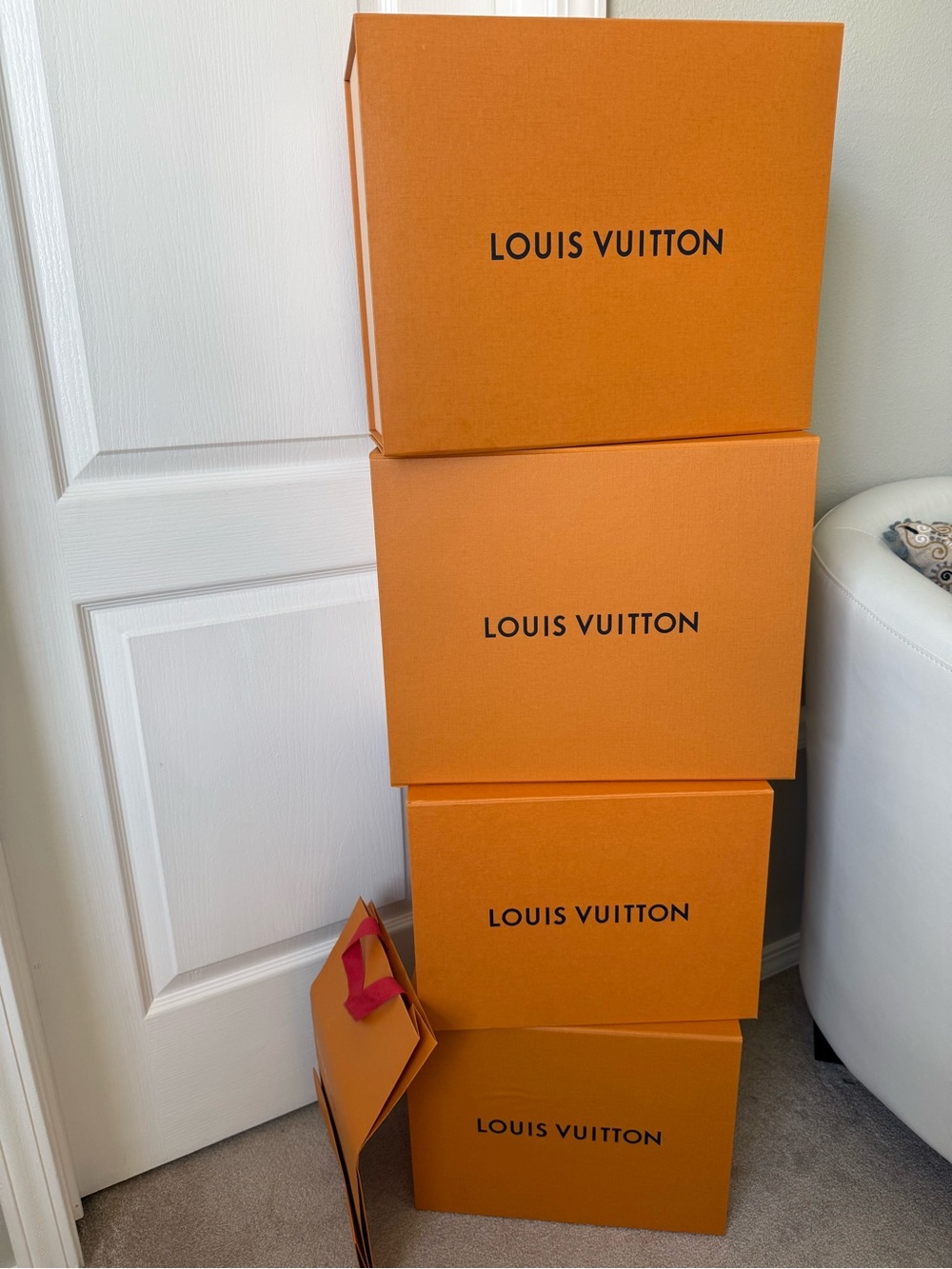 LV boxes, 4 boxes, ribbons, two dust bags.